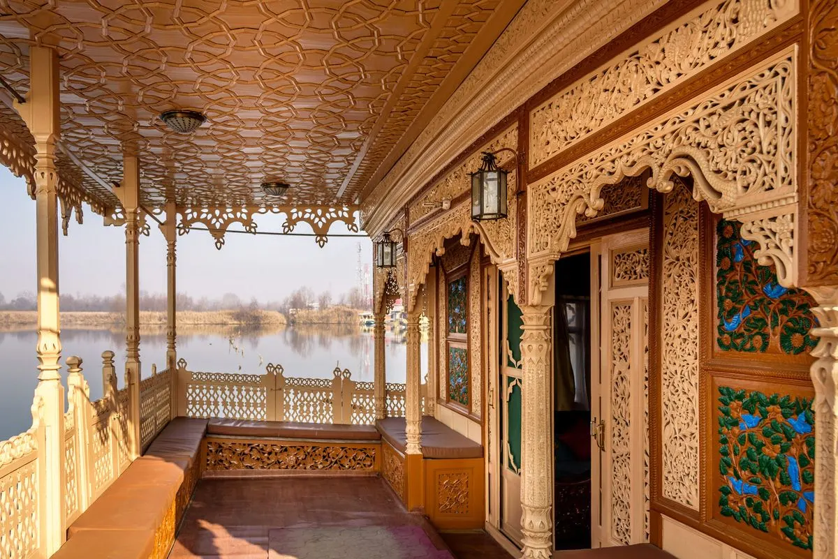 Houseboats lining the tree-fringed shore of Dal Lake in Srinagar